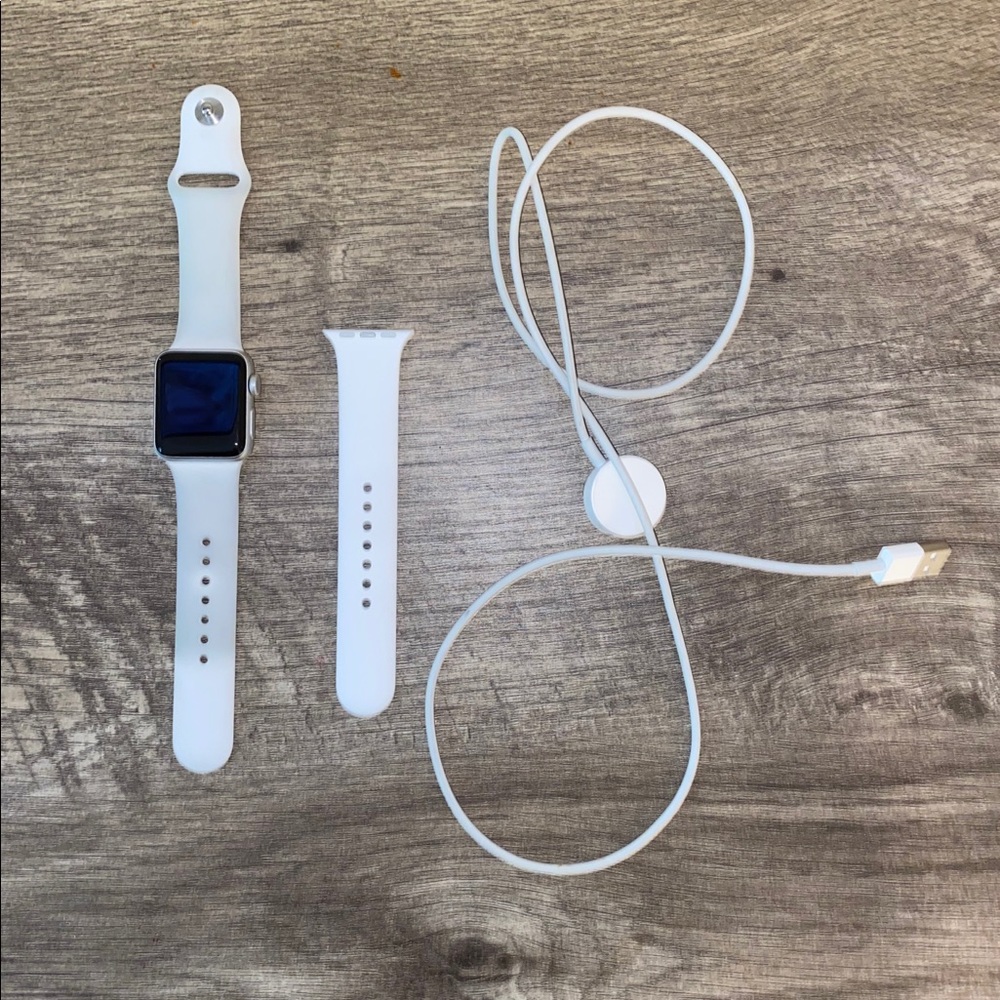 Series 3 Apple Watch, charger, and extra strap